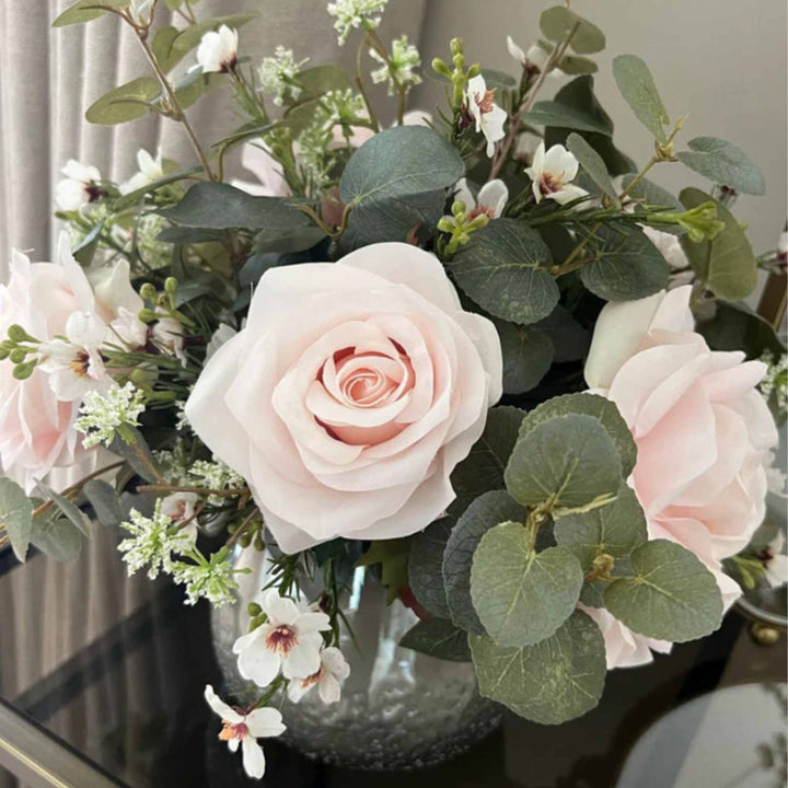 Eucalyptus, Roses and Waxflower in a Smokey Vase small