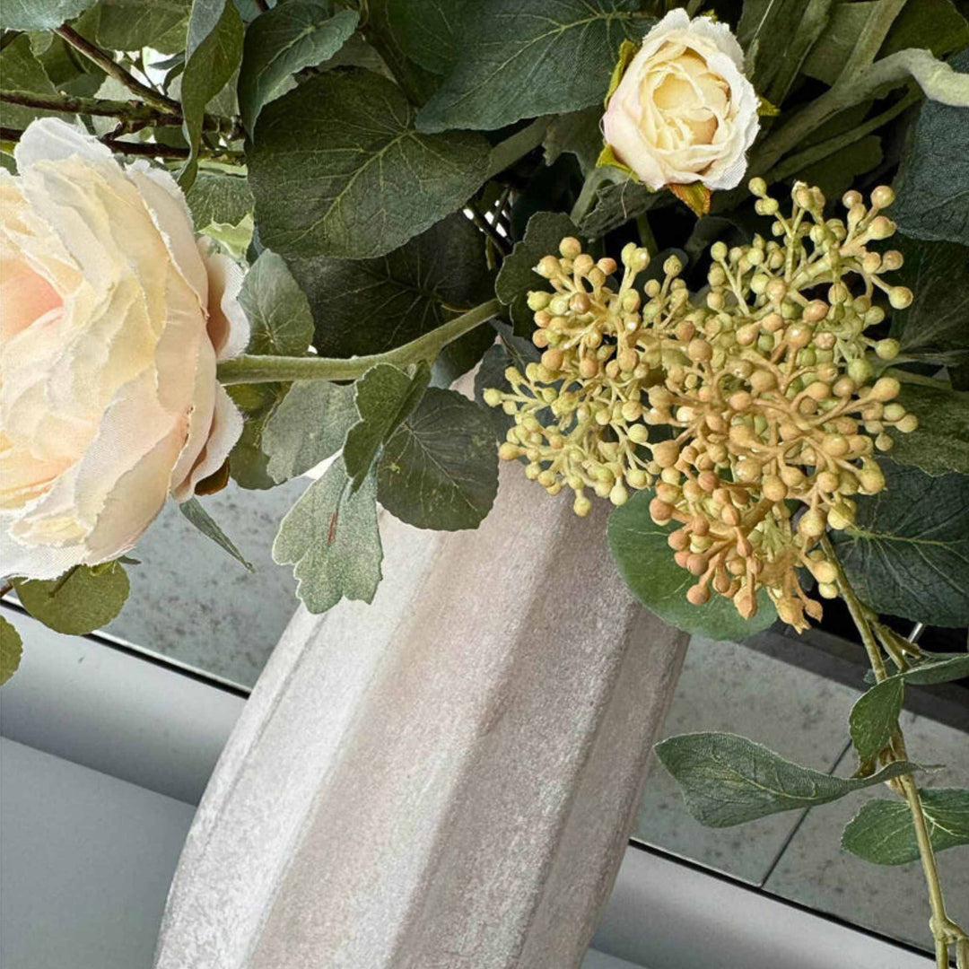 Pink Ranunculus and Eucalyptus in a Frosted Vase