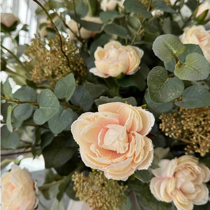 Pink Ranunculus and Eucalyptus in a Frosted Vase